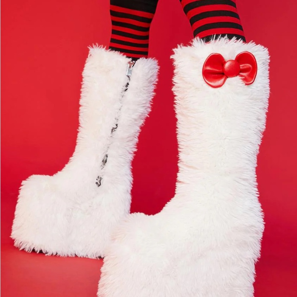 Dolls Kill White Fuzzy Knee-High Boots with Red Bow Accent